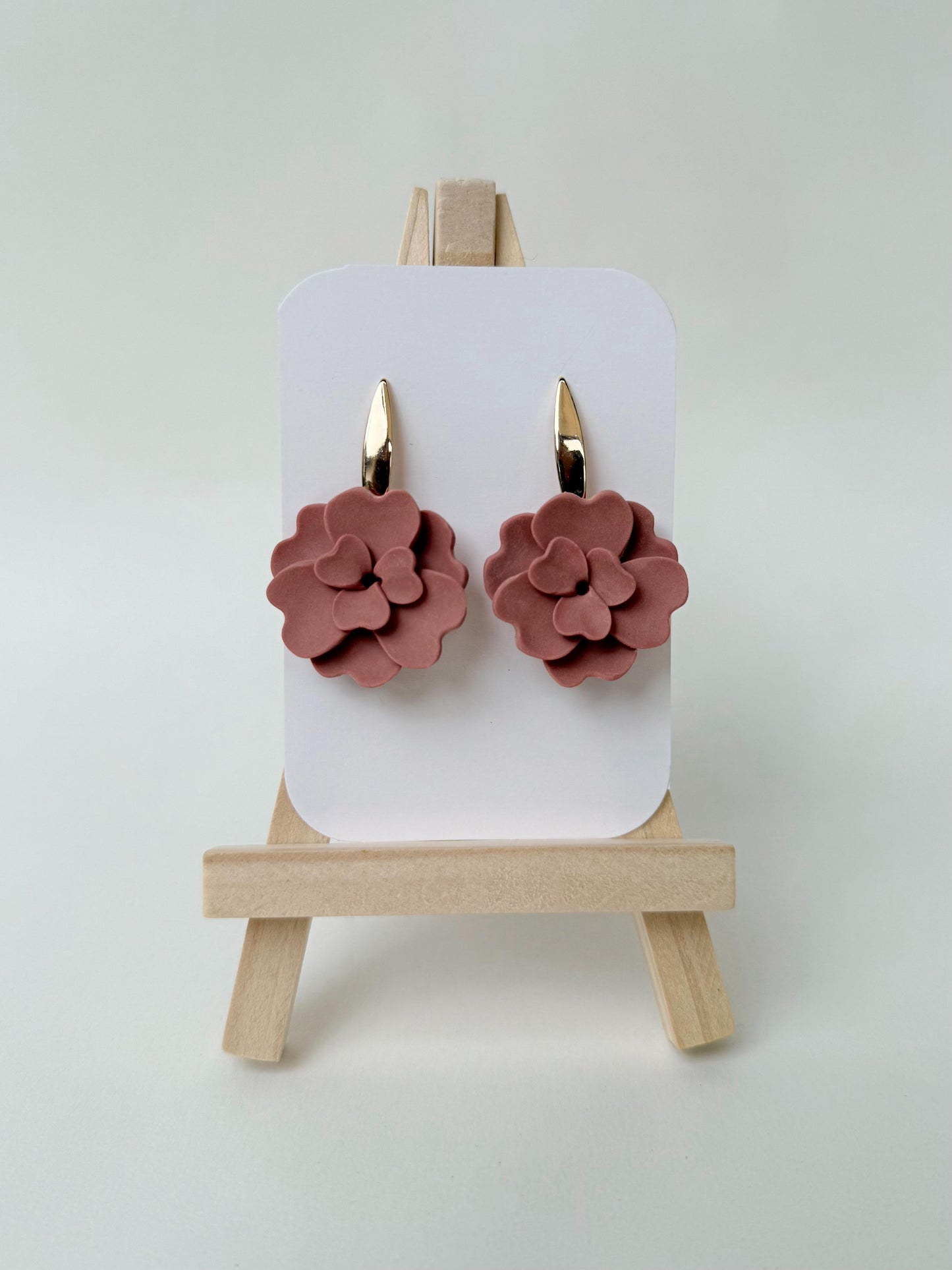 NORA Rosa amarrando con dorado